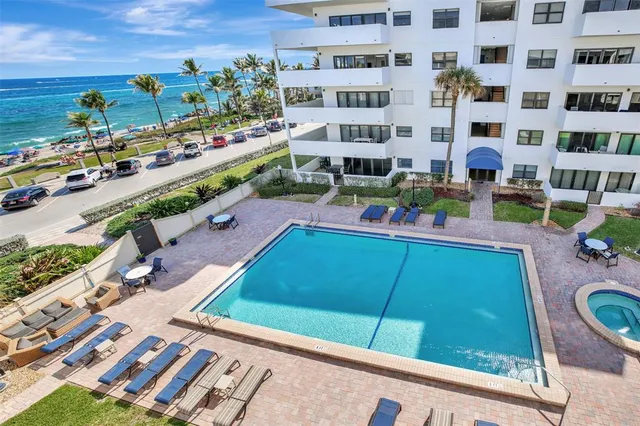 a kitchen with stainless steel appliances a refrigerator and a stove