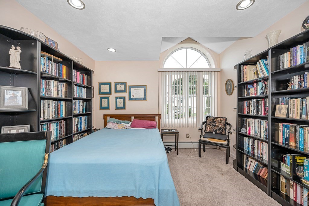 49 Susan Drive Saugus, MA 01906 - Photo 12 of 33 a bedroom with furniture and a book shelf