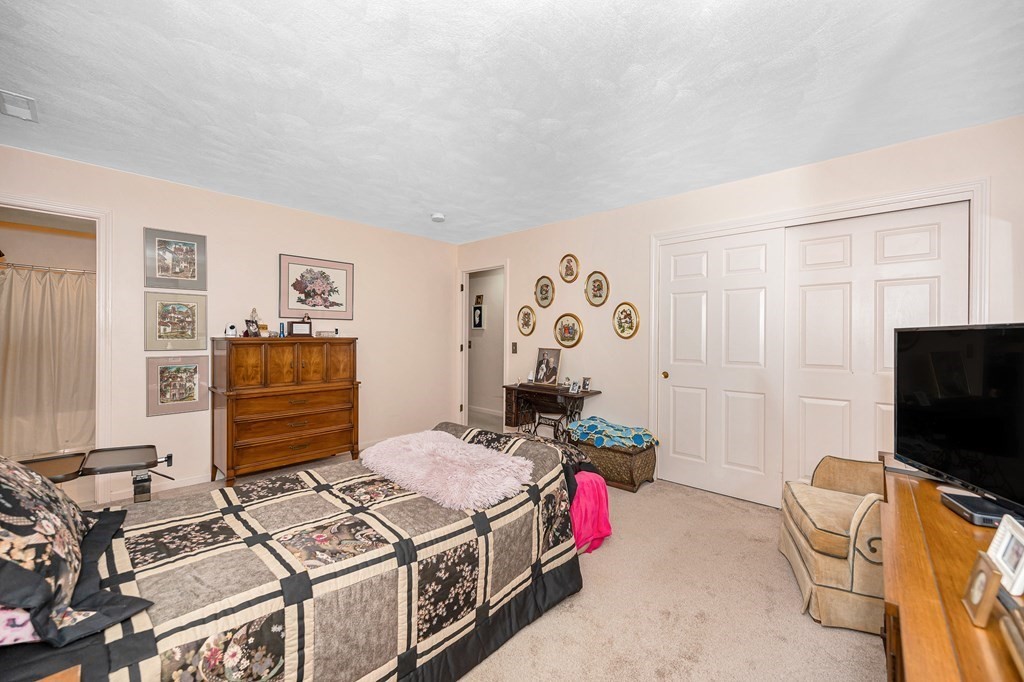 49 Susan Drive Saugus, MA 01906 - Photo 16 of 33 a bedroom with furniture and flat screen tv