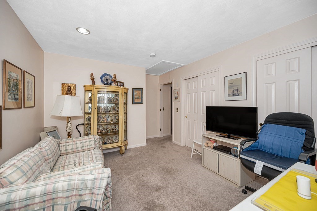 49 Susan Drive Saugus, MA 01906 - Photo 20 of 33 a bedroom with furniture and a flat screen tv