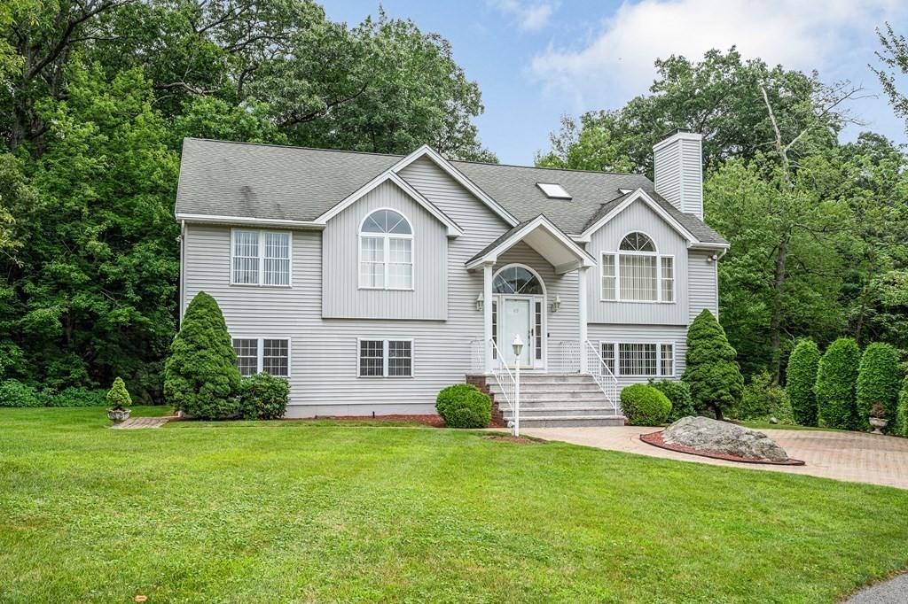 49 Susan Drive Saugus, MA 01906 - Photo 2 of 33 a front view of a house with a yard