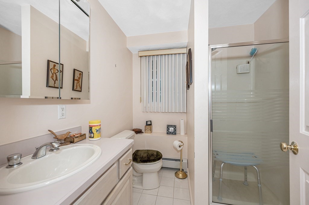 49 Susan Drive Saugus, MA 01906 - Photo 30 of 33 a bathroom with a sink toilet and shower