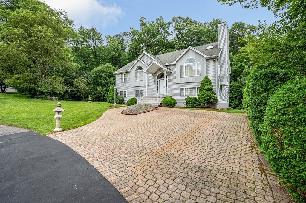49 Susan Drive Saugus, MA 01906 - Photo 32 of 33 a front view of a house with a yard and garage