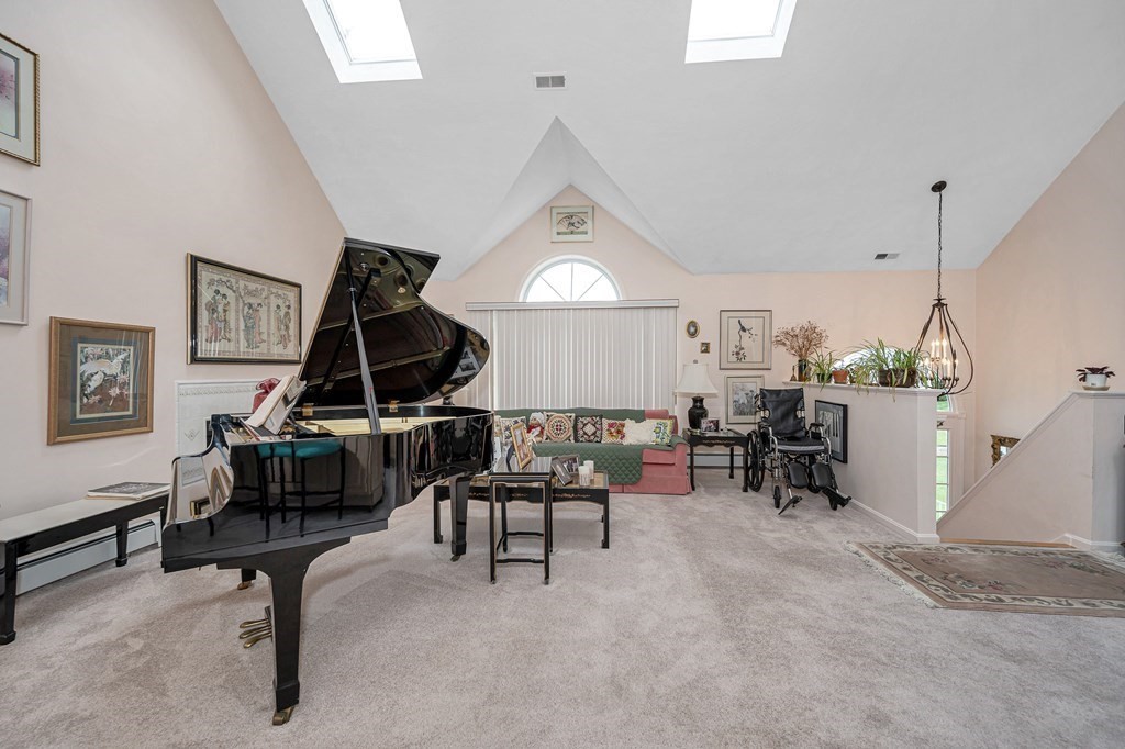 49 Susan Drive Saugus, MA 01906 - Photo 5 of 33 a living room with furniture a dining table and a piano