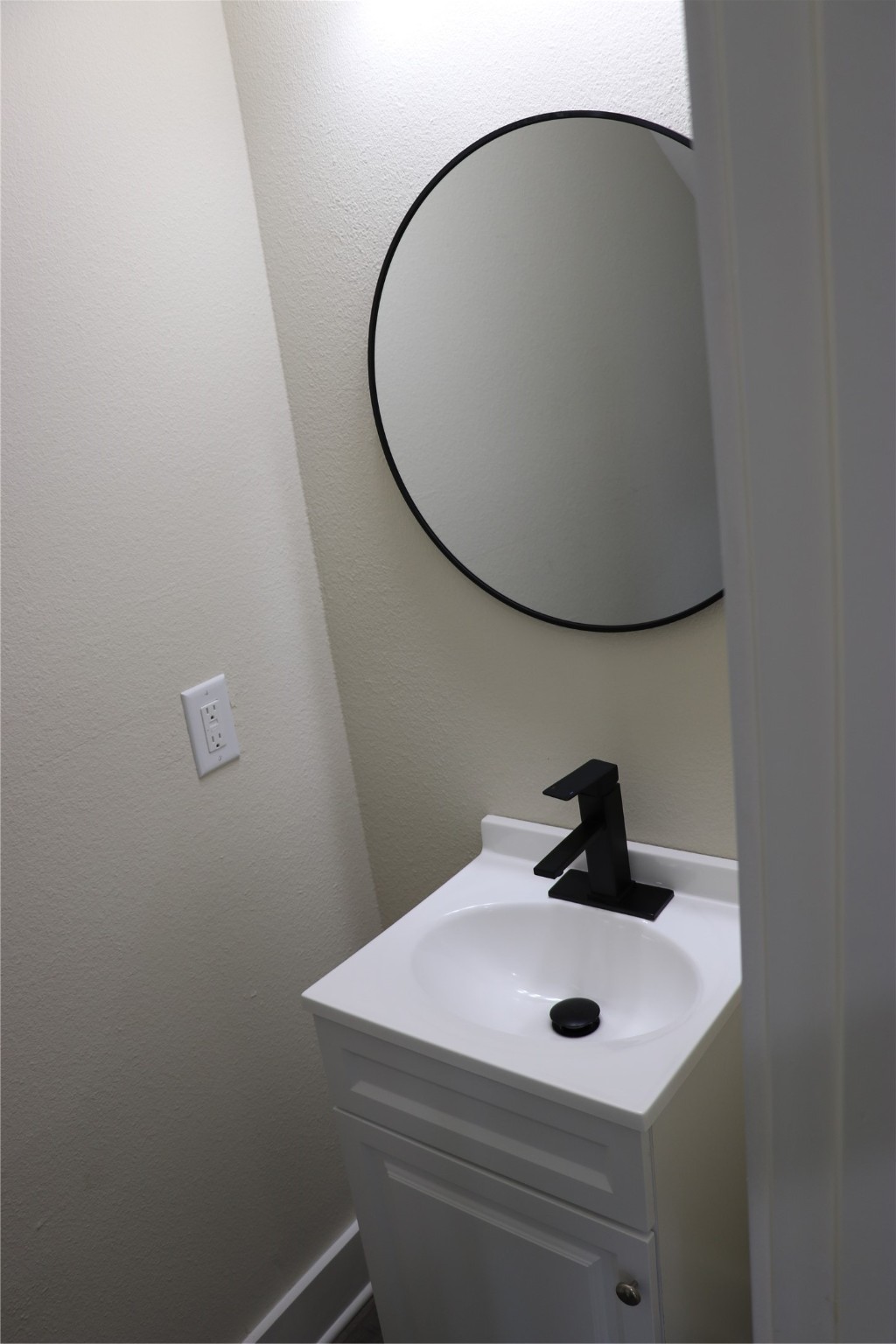 9439 Radio Road, Unit B Houston, TX 77075 - Photo 22 of 23 a bathroom with a sink and mirror