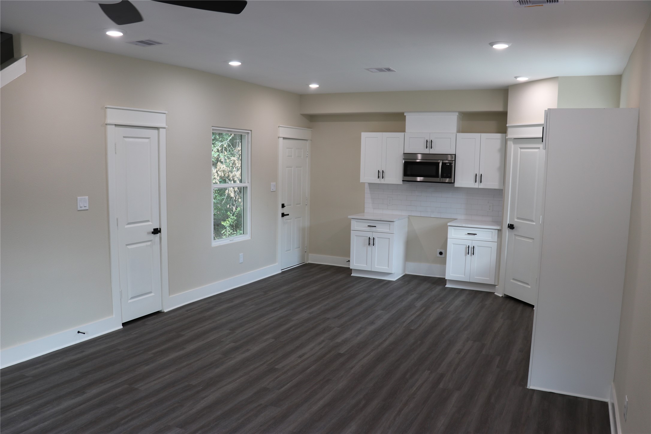 9439 Radio Road, Unit B Houston, TX 77075 - Photo 5 of 23 a kitchen with stainless steel appliances a refrigerator sink and microwave
