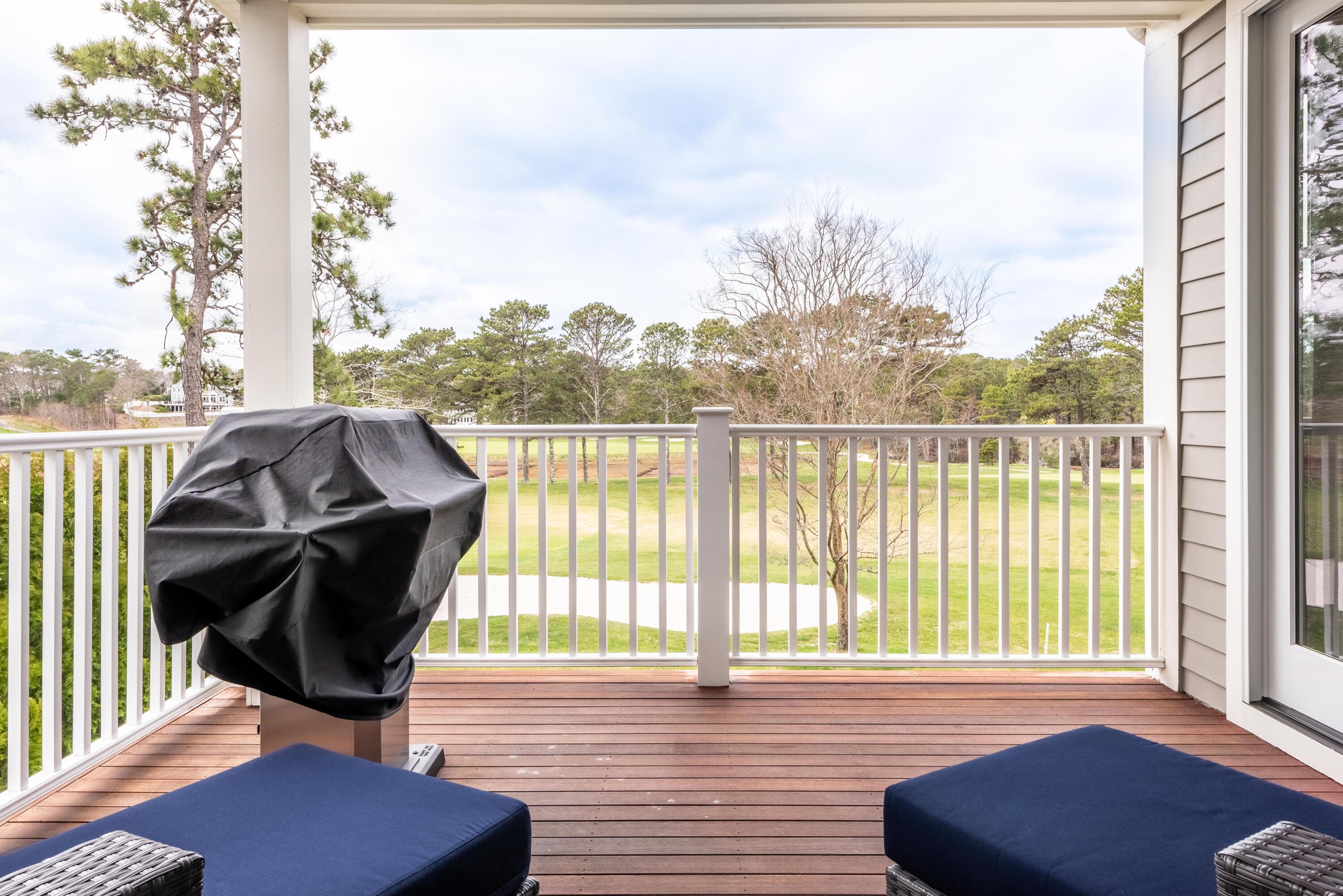 66 Simons Road, Unit C Mashpee, MA 02649 - Photo 11 of 11 a view of a balcony with chairs