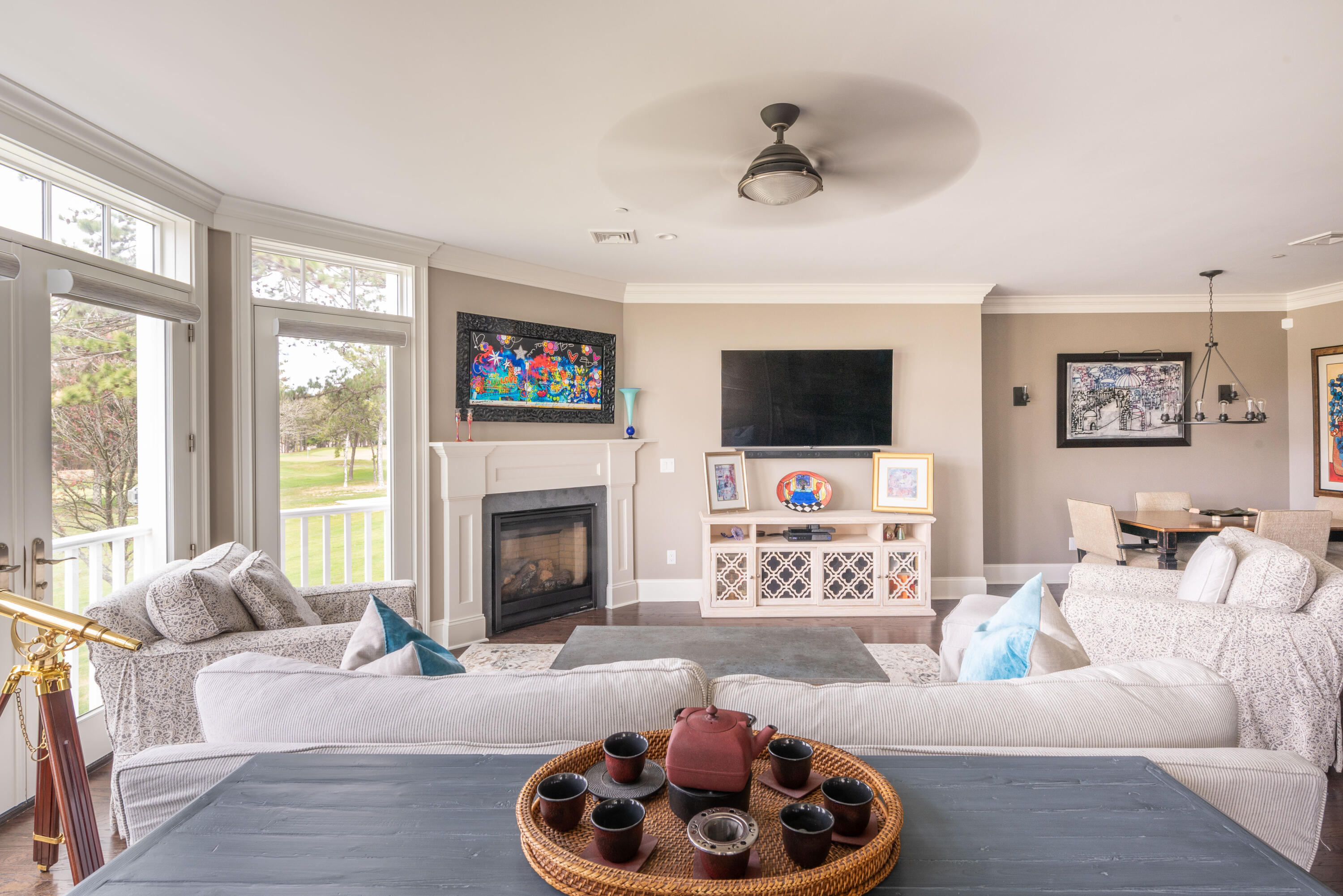 66 Simons Road, Unit C Mashpee, MA 02649 - Photo 2 of 11 a living room with furniture and a fireplace