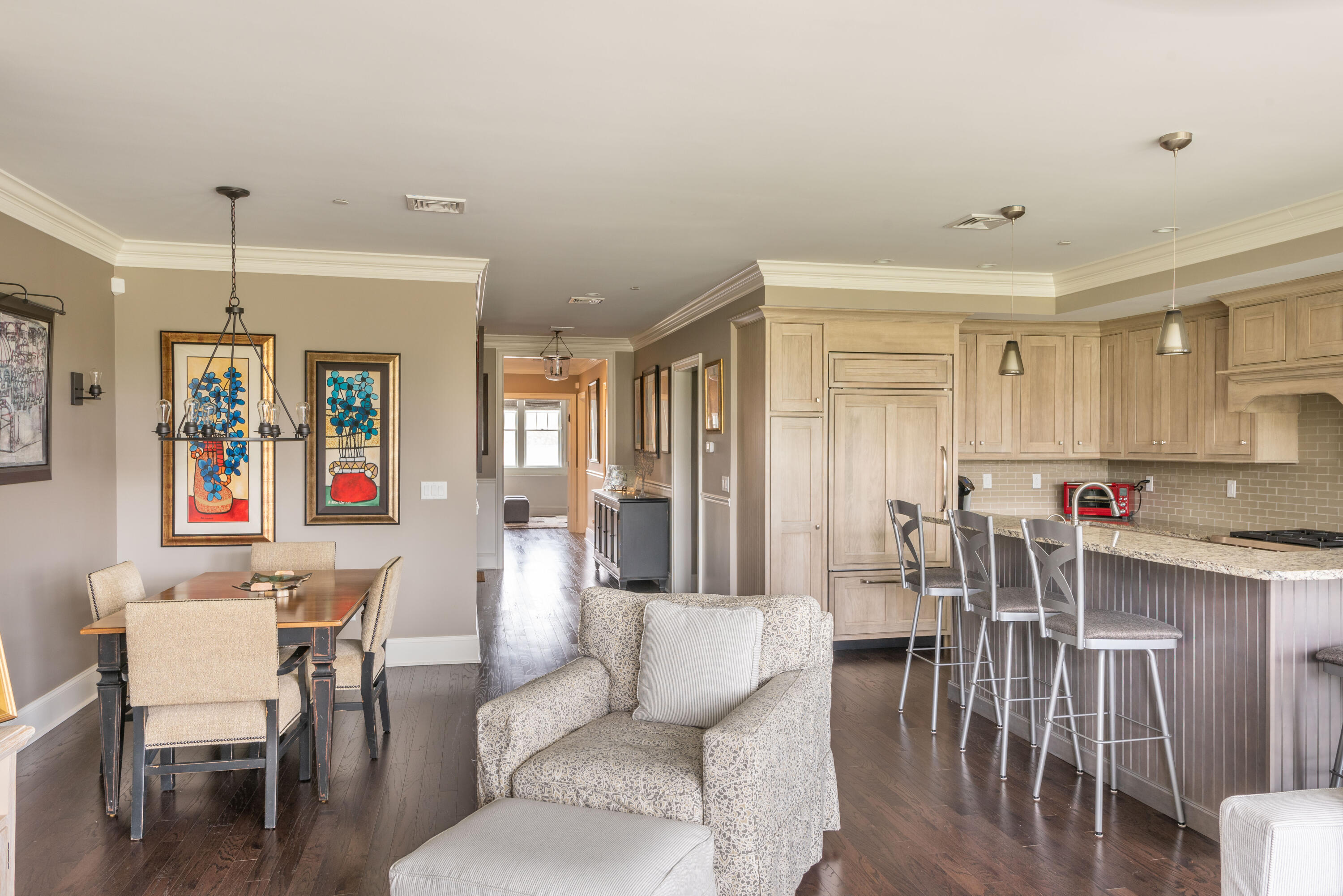 66 Simons Road, Unit C Mashpee, MA 02649 - Photo 4 of 11 a living room with furniture kitchen and a table