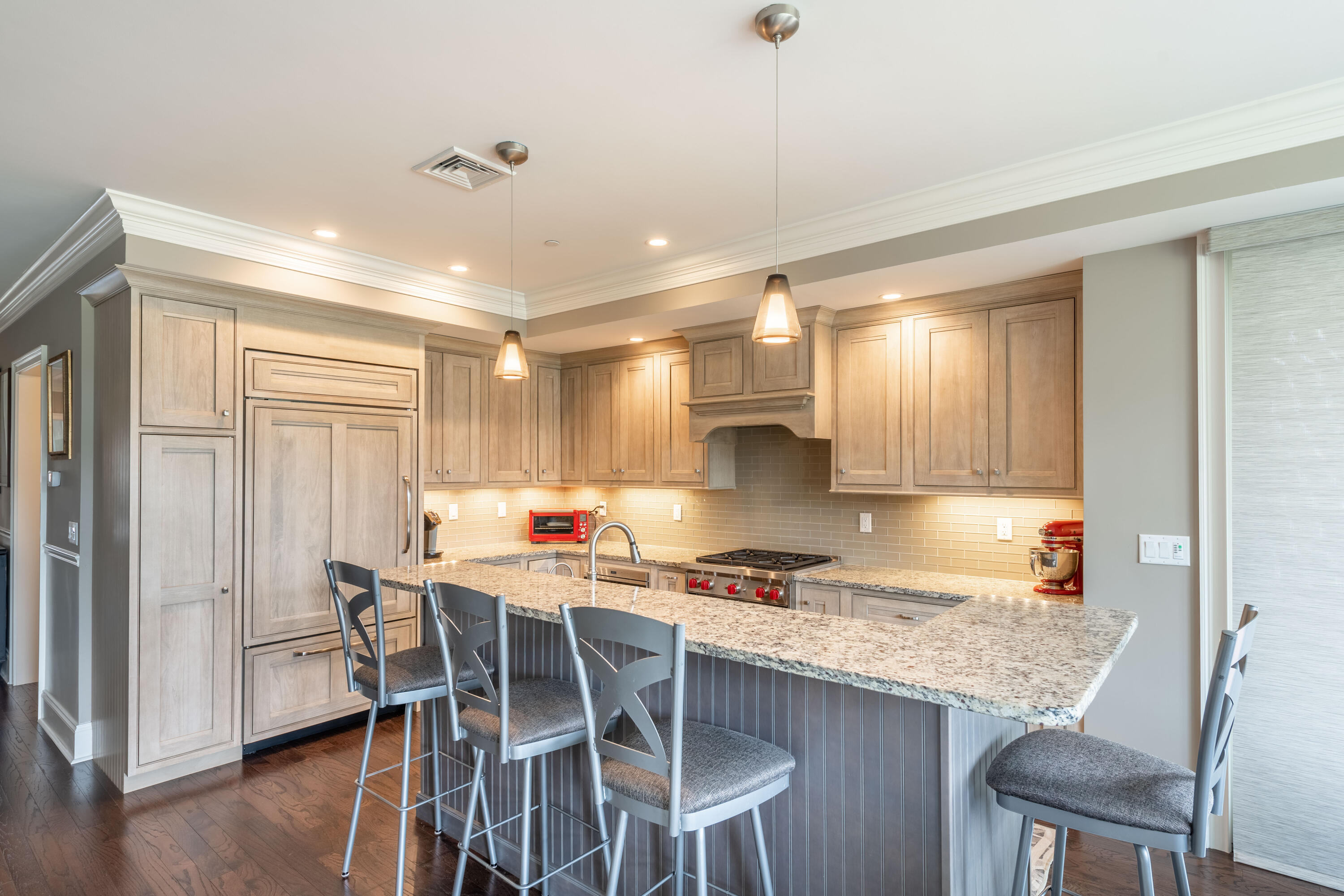 66 Simons Road, Unit C Mashpee, MA 02649 - Photo 6 of 11 a kitchen with a dining table chairs and refrigerator