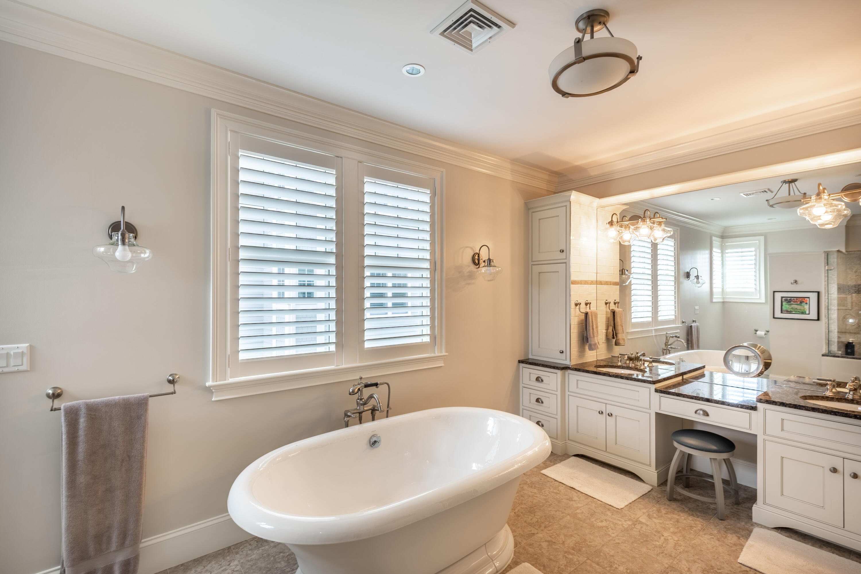 66 Simons Road, Unit C Mashpee, MA 02649 - Photo 8 of 11 a bathroom with a double vanity sink a mirror and a bathtub