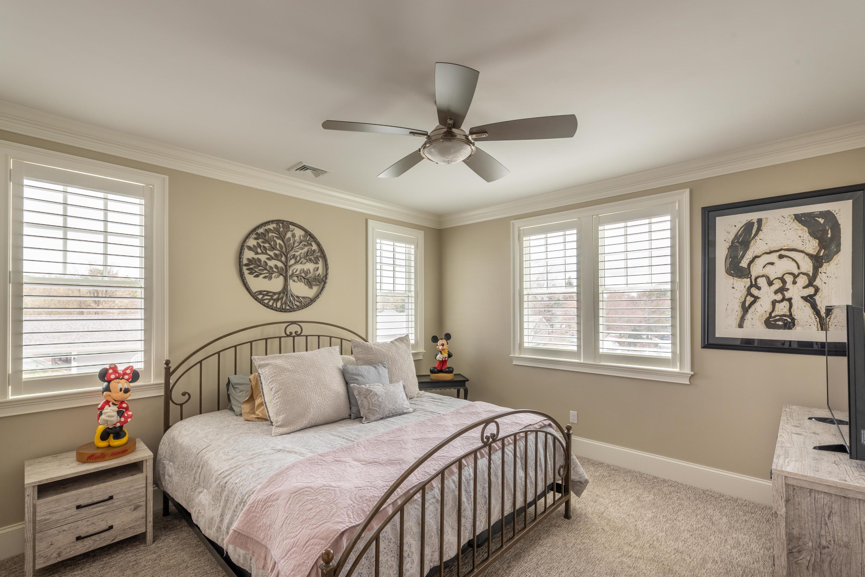 66 Simons Road, Unit C Mashpee, MA 02649 - Photo 9 of 11 a bedroom with a bed and window