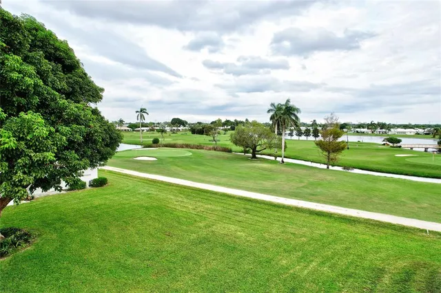 a view of a golf course with a lake