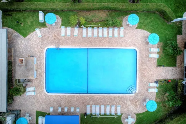 a view of a house with a yard and plants