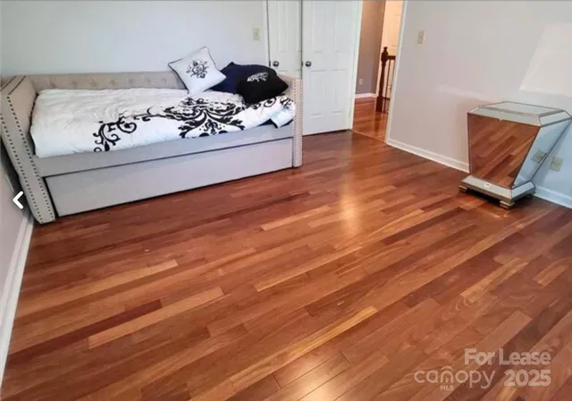 a living room with a hard wood floor