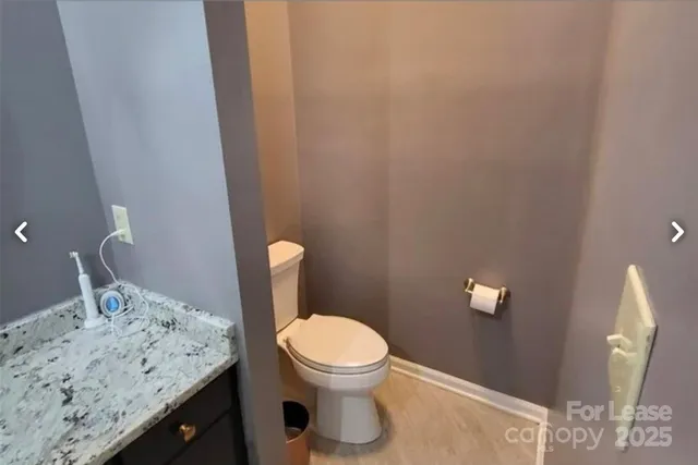 a bathroom with a toilet and a sink