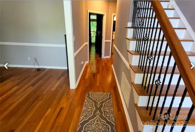a view of entryway with wooden floor