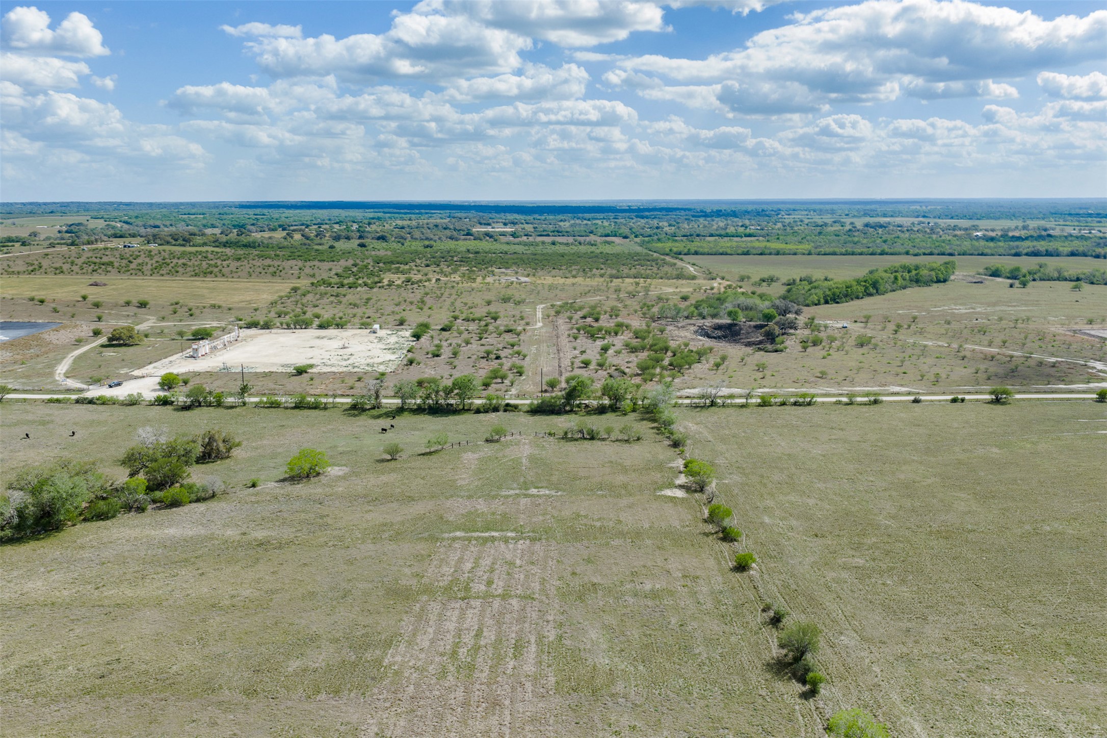 Lot 1 Concrete-Edgar Road Cuero, TX 77954 - Photo 4 of 17 a view of a lake with houses in the back