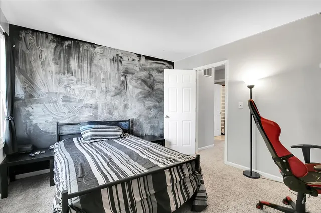 a bedroom with a bed and furniture