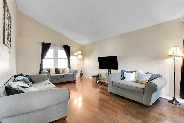 a living room with furniture and a large window