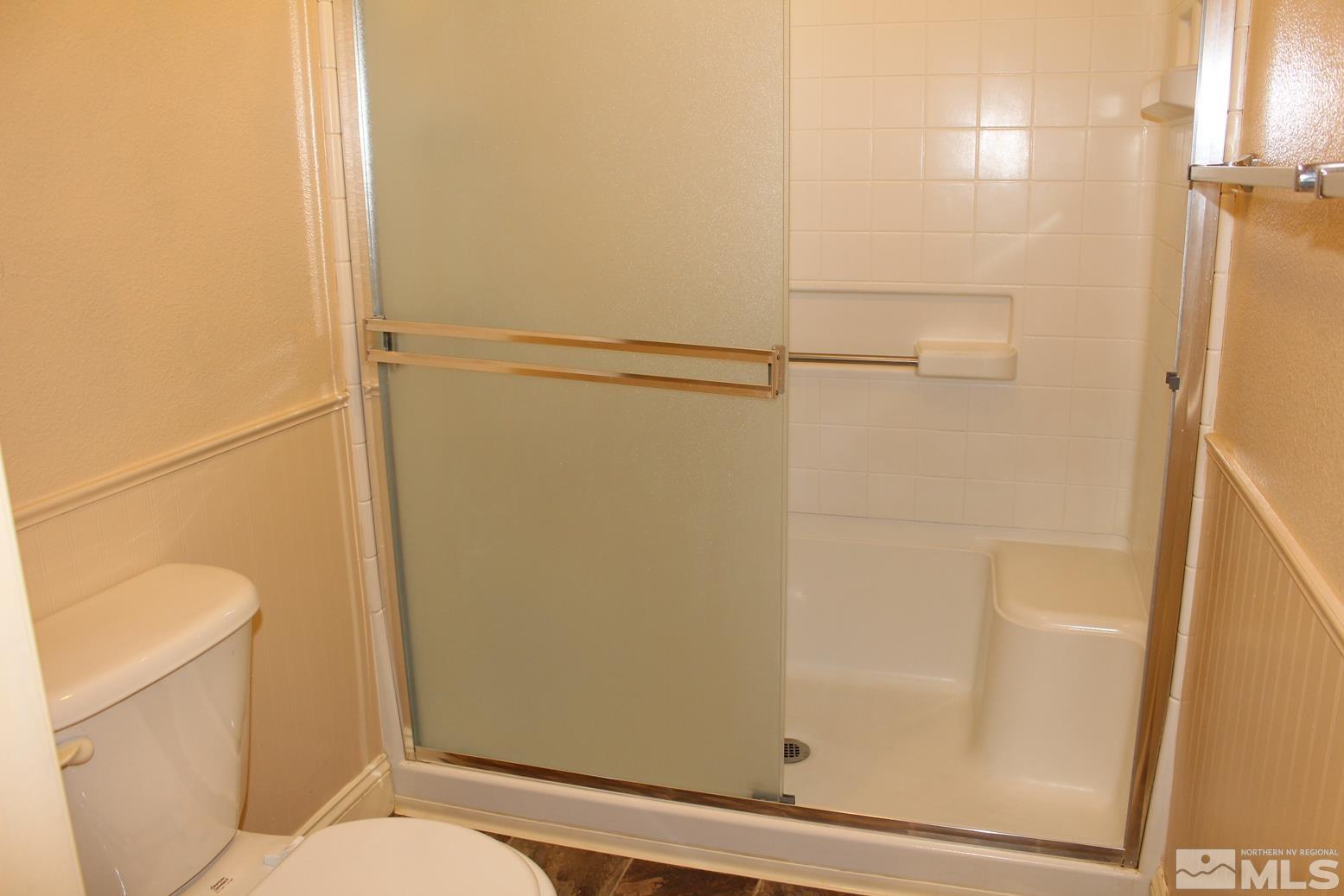 100 Calistoga Court Reno, NV 89508 - Photo 19 of 40 a bathroom with a shower and a toilet