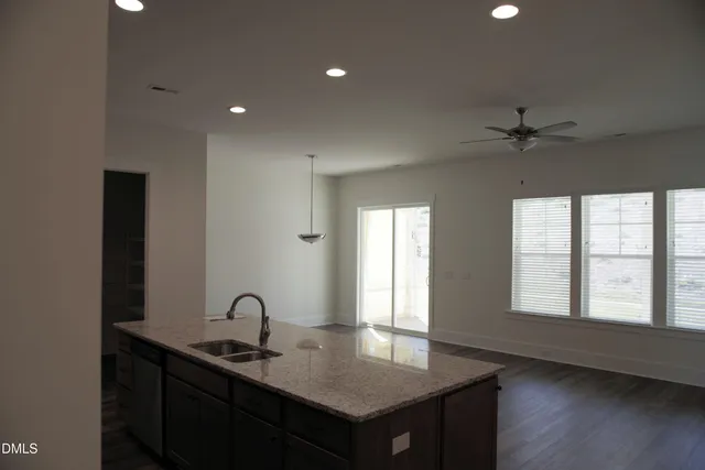 a open kitchen with sink and window