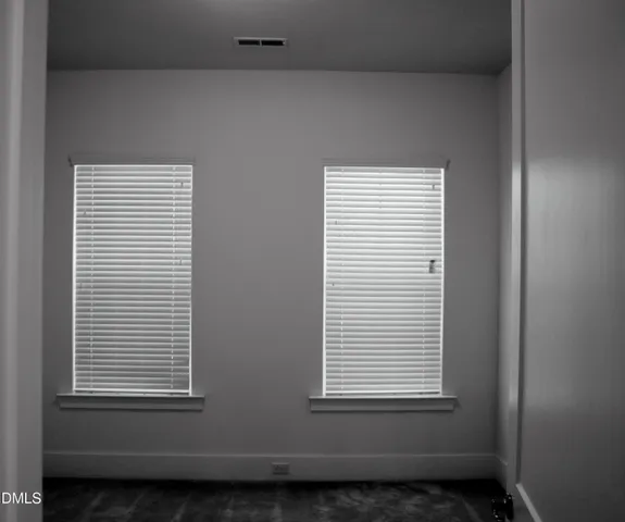 a view of a room that has a window in it