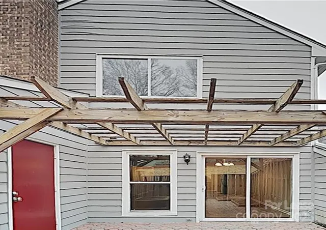 a view of a house with large windows