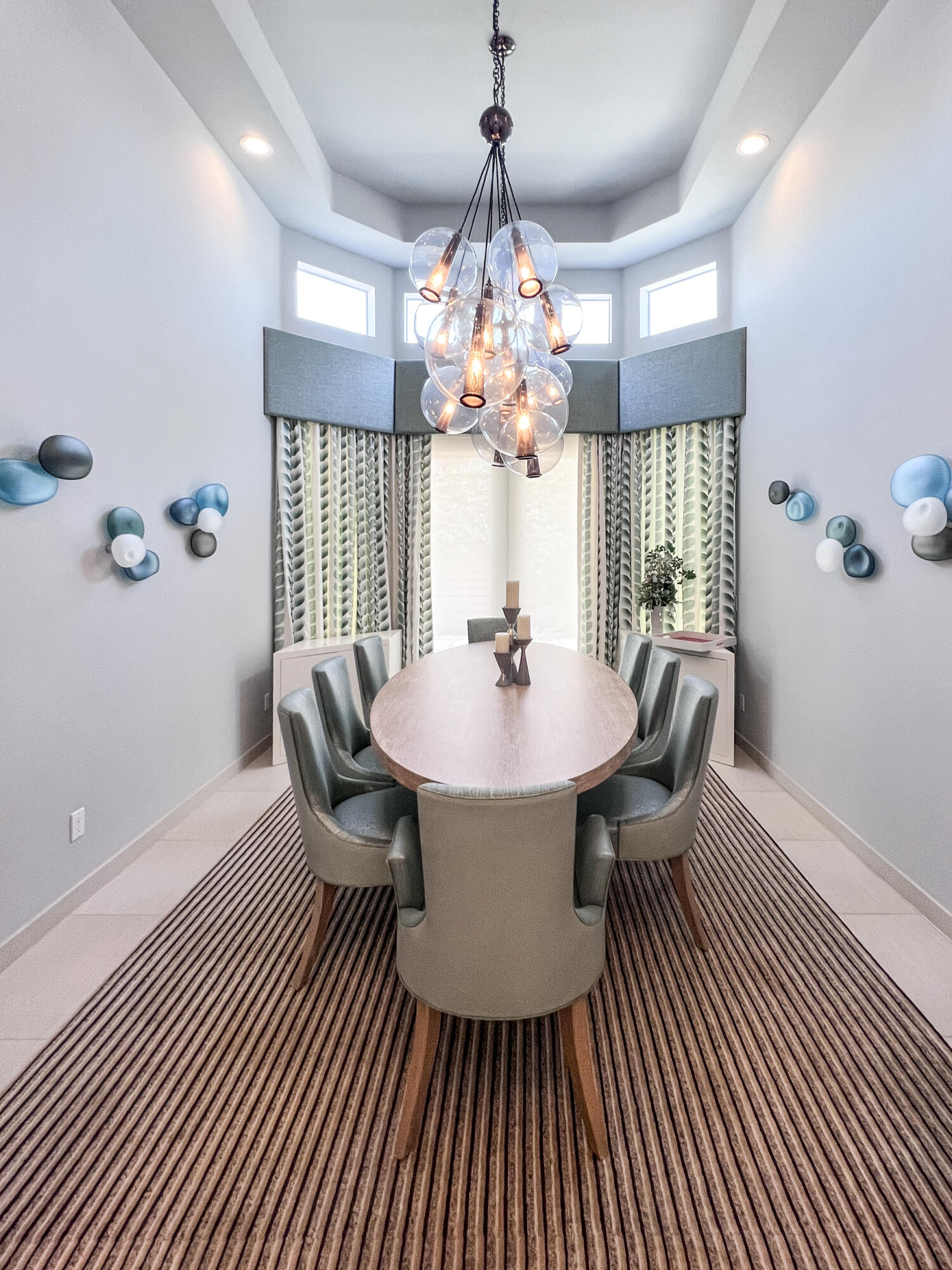 12 Varsity Circle Rancho Mirage, CA 92270 - Photo 11 of 70 a dining room with furniture a chandelier and wooden floor