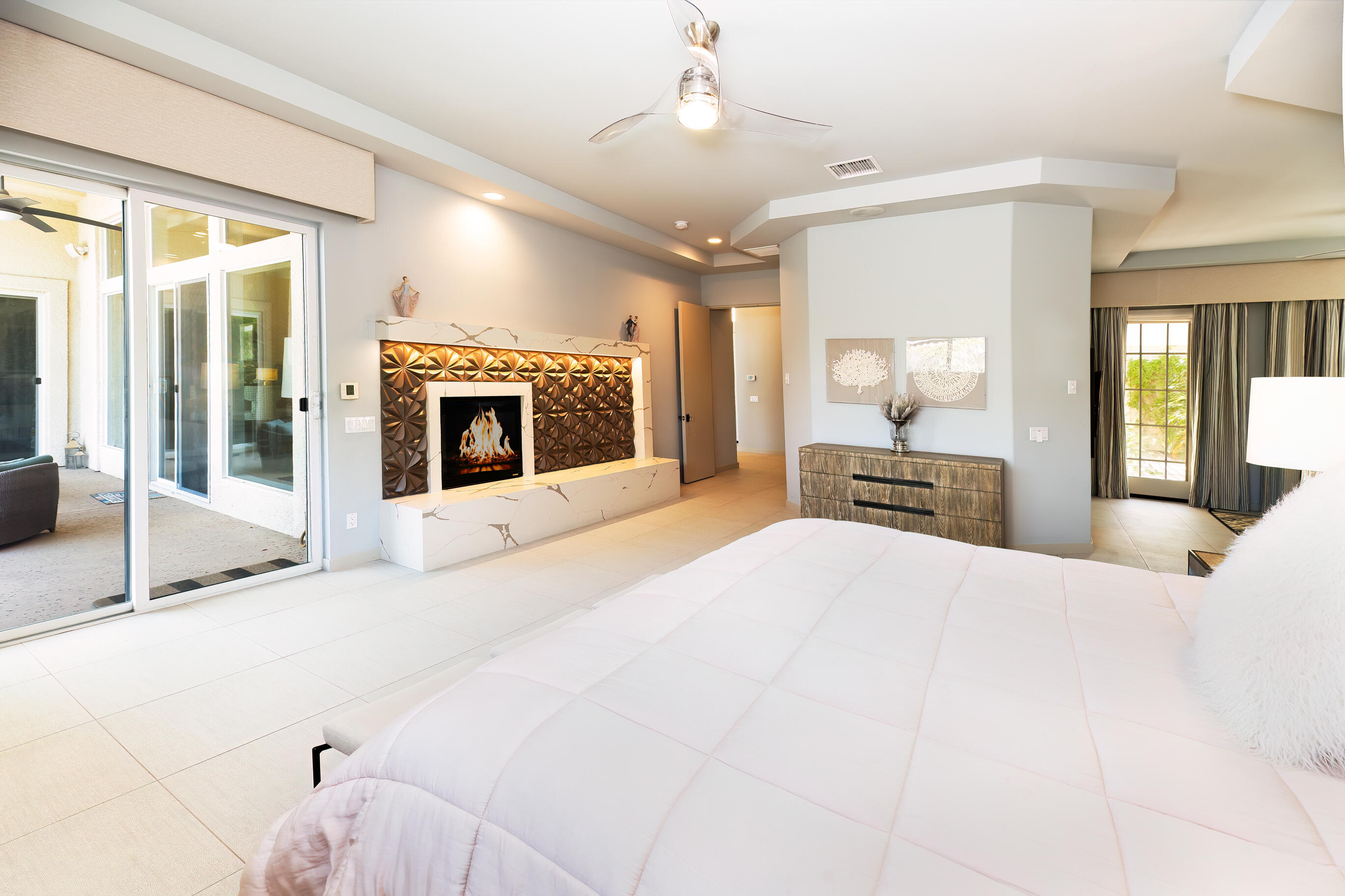12 Varsity Circle Rancho Mirage, CA 92270 - Photo 20 of 70 a large white bedroom with a large bed and a large mirror with dresser