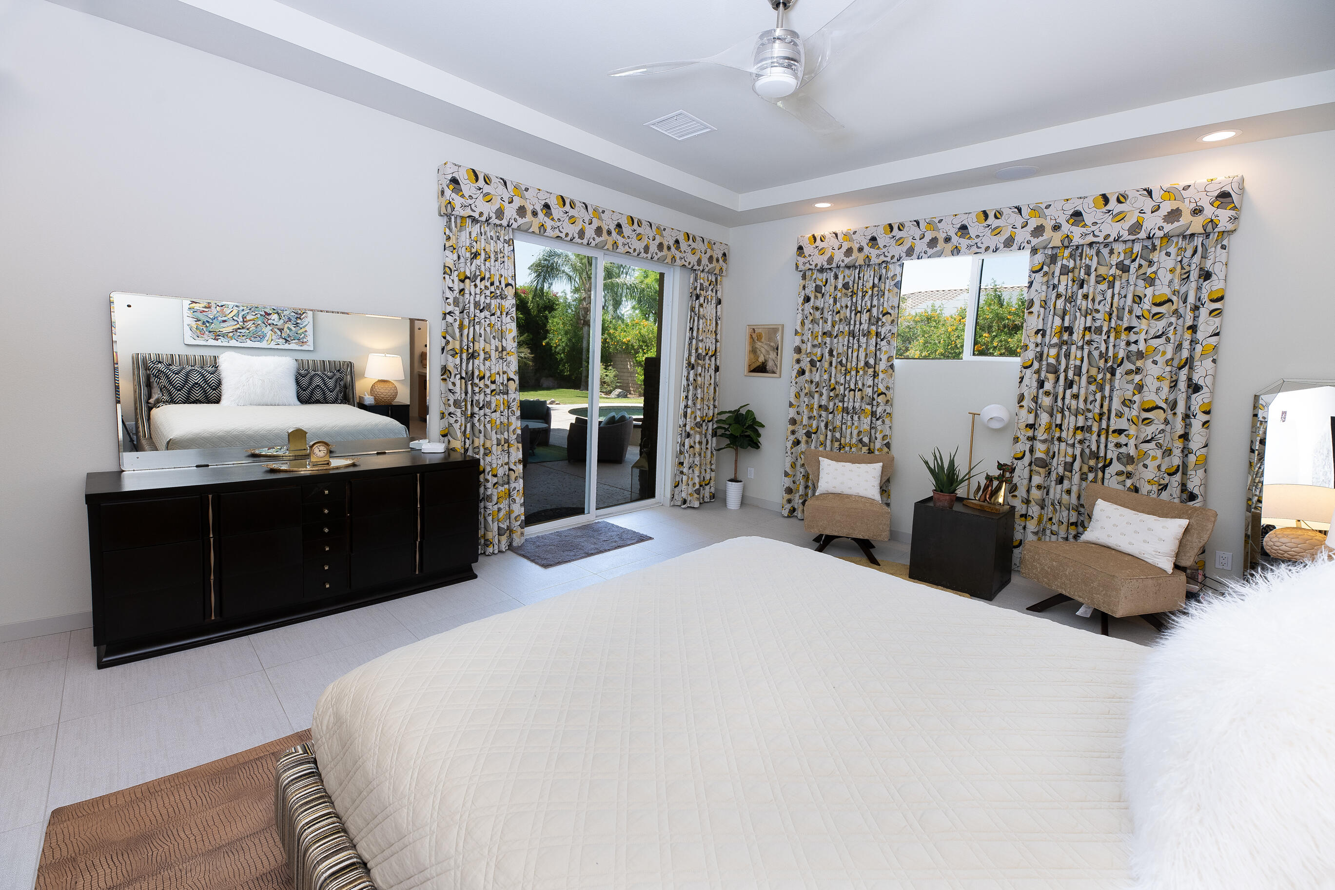 12 Varsity Circle Rancho Mirage, CA 92270 - Photo 31 of 70 a bedroom with a large bed and a window