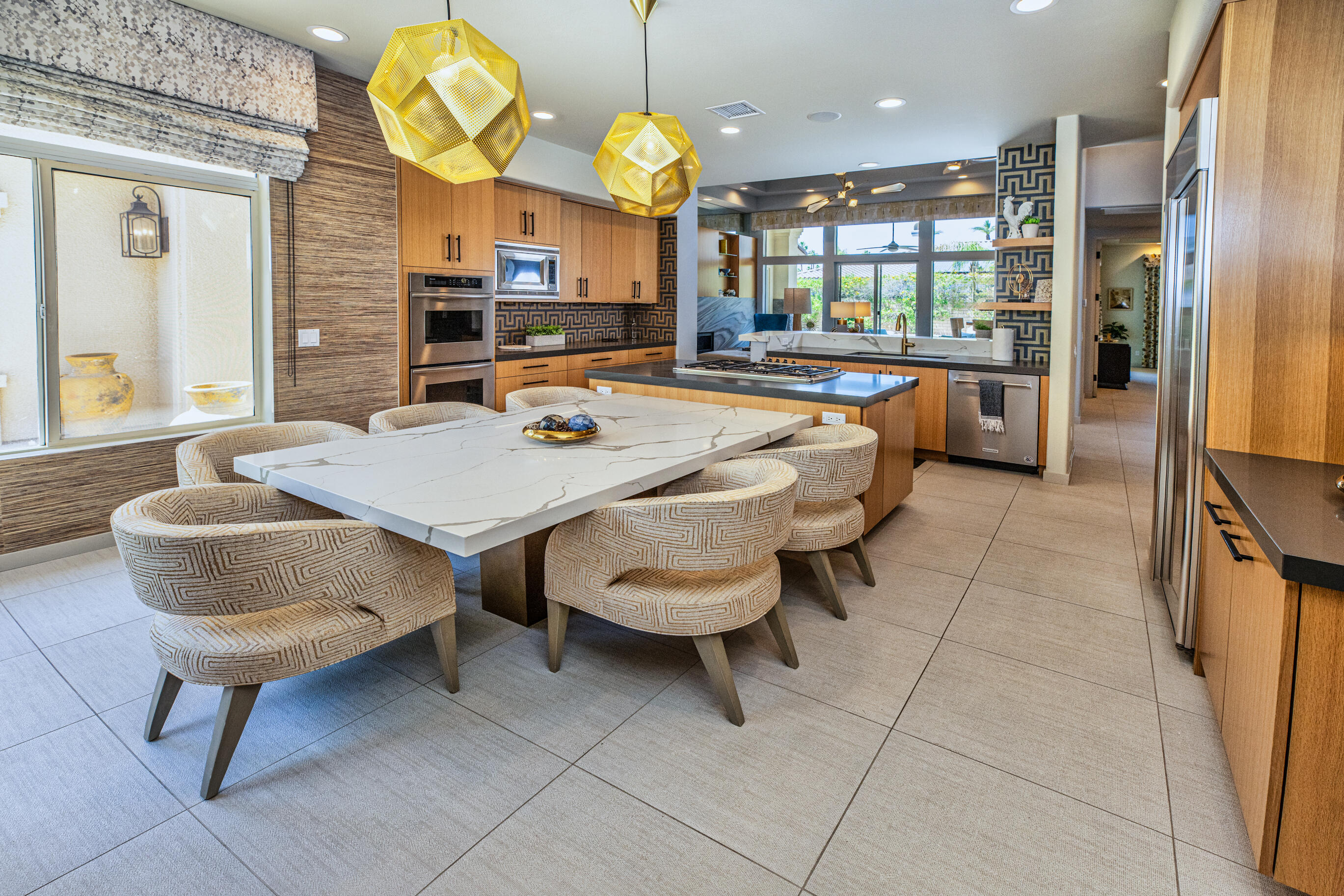 12 Varsity Circle Rancho Mirage, CA 92270 - Photo 36 of 70 a large kitchen with a table and chairs