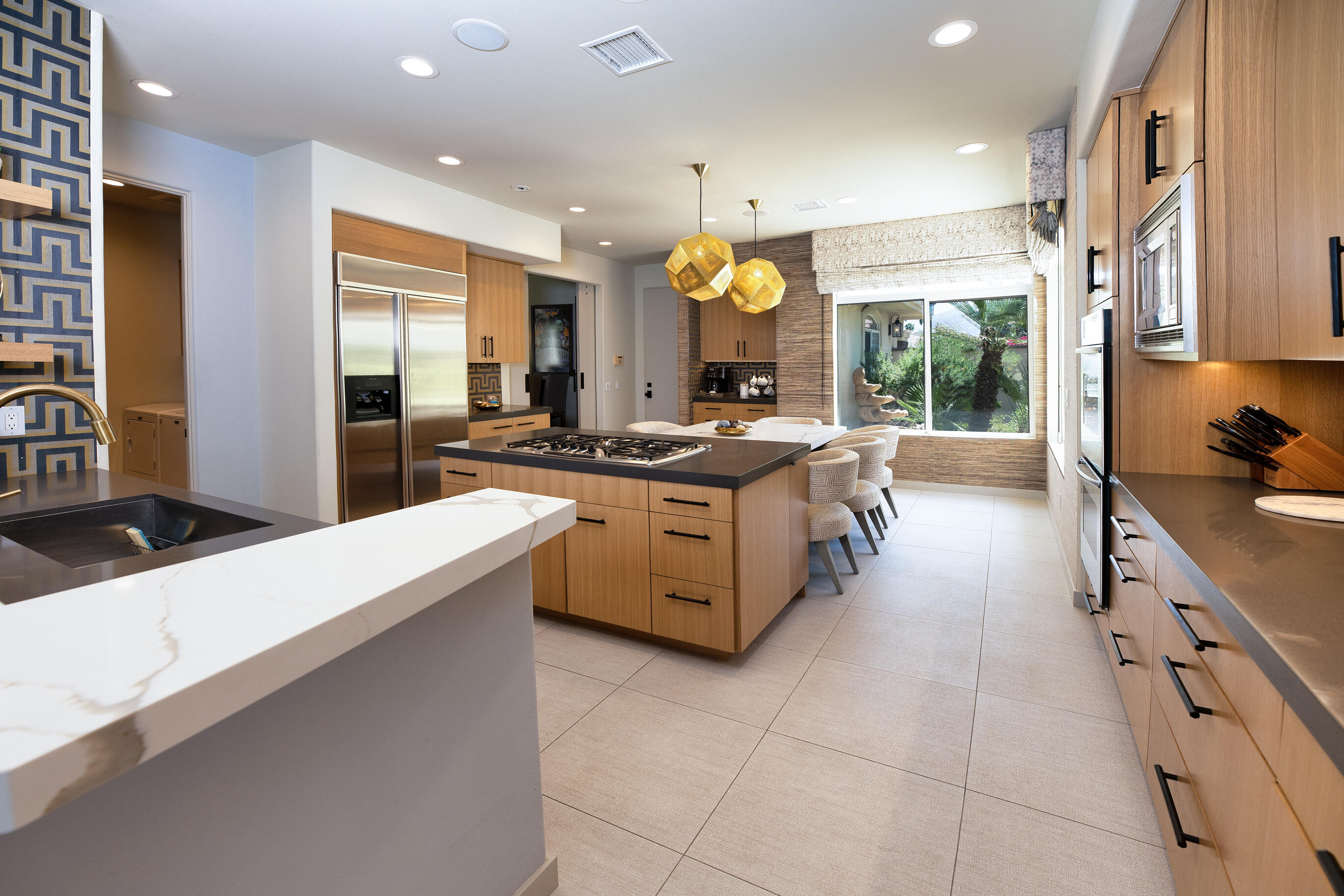 12 Varsity Circle Rancho Mirage, CA 92270 - Photo 37 of 70 a kitchen with stainless steel appliances granite countertop a stove and a sink