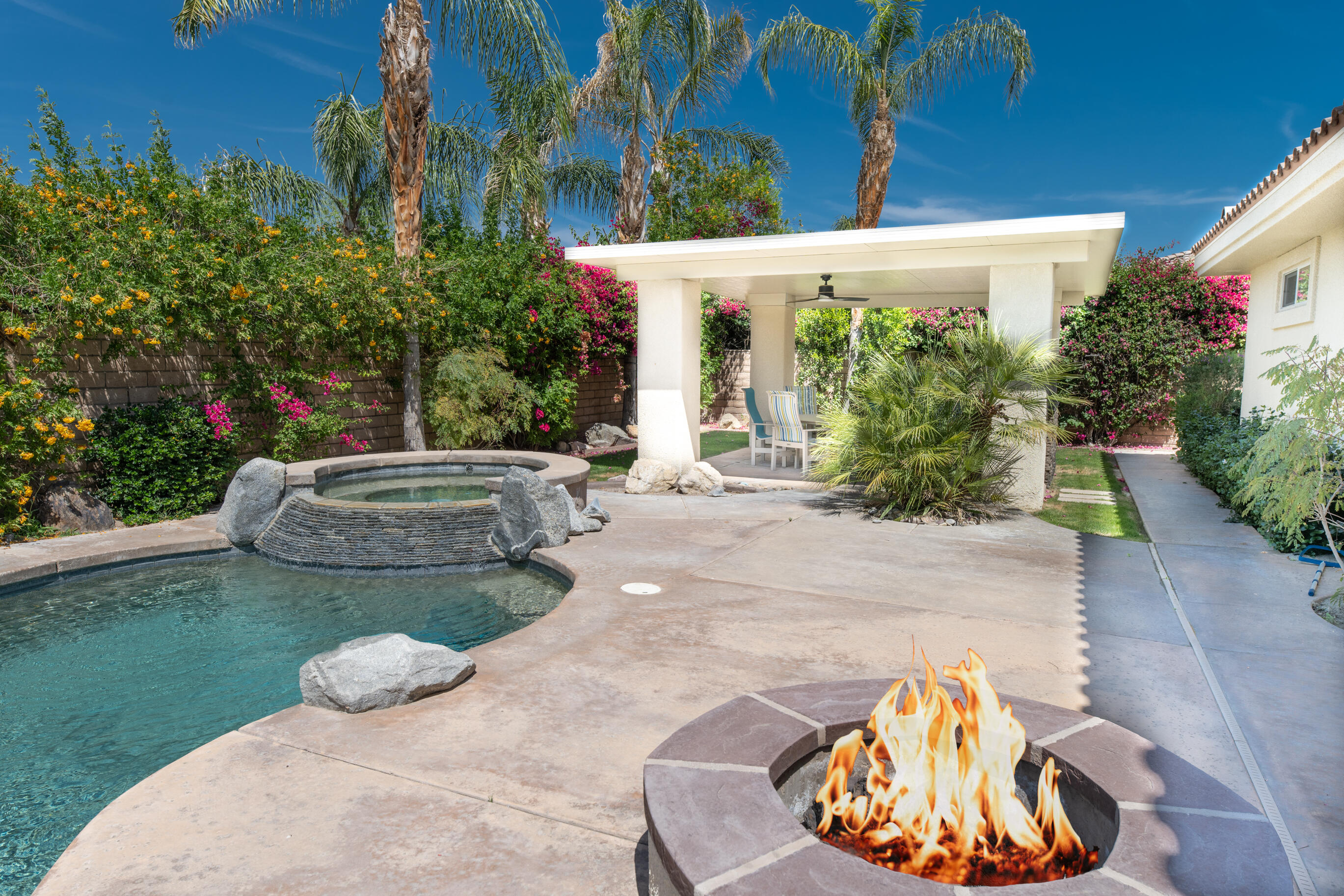 12 Varsity Circle Rancho Mirage, CA 92270 - Photo 46 of 70 a view of a backyard with plants and outdoor seating