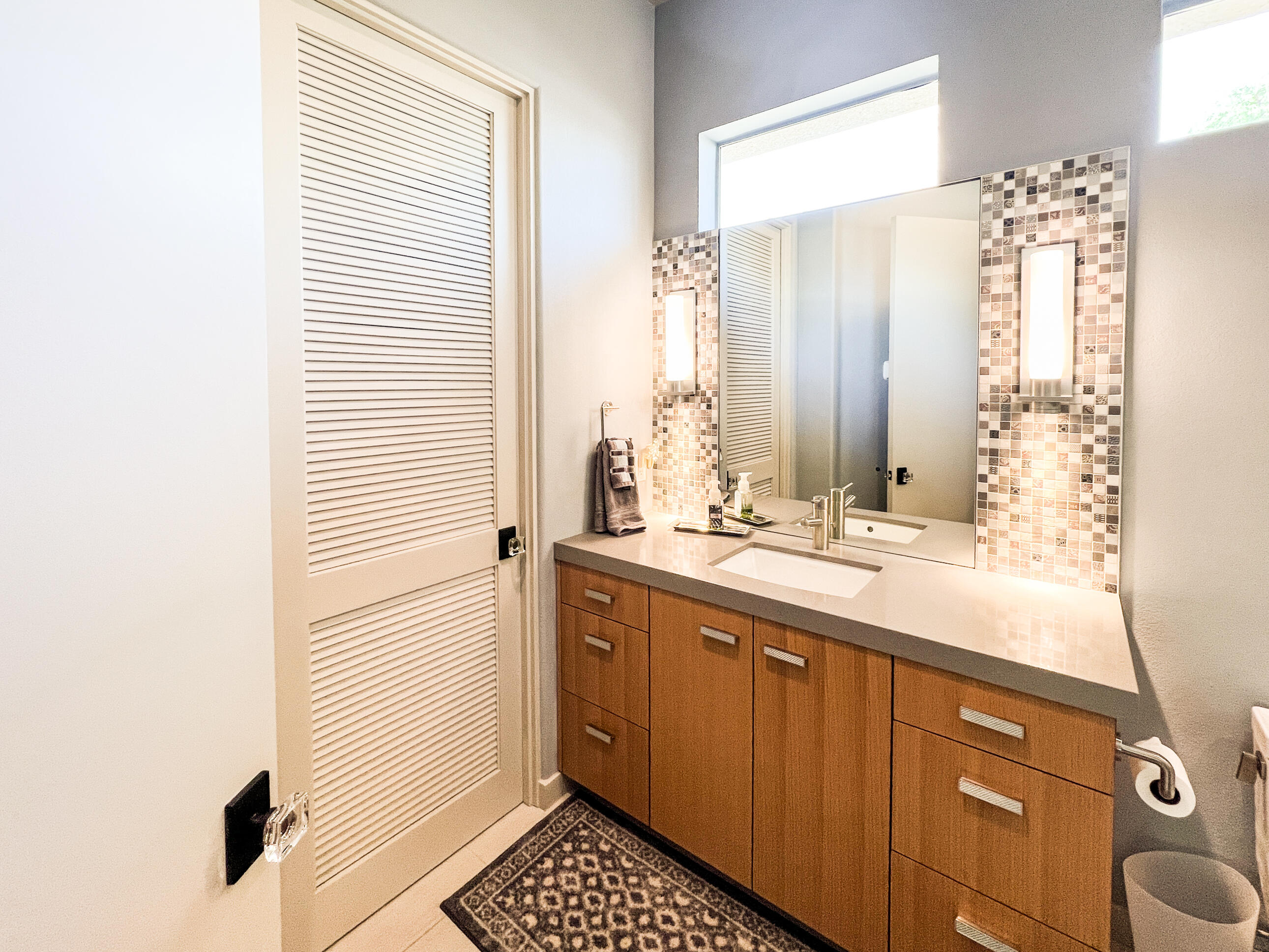 12 Varsity Circle Rancho Mirage, CA 92270 - Photo 57 of 70 a bathroom with a sink and a mirror