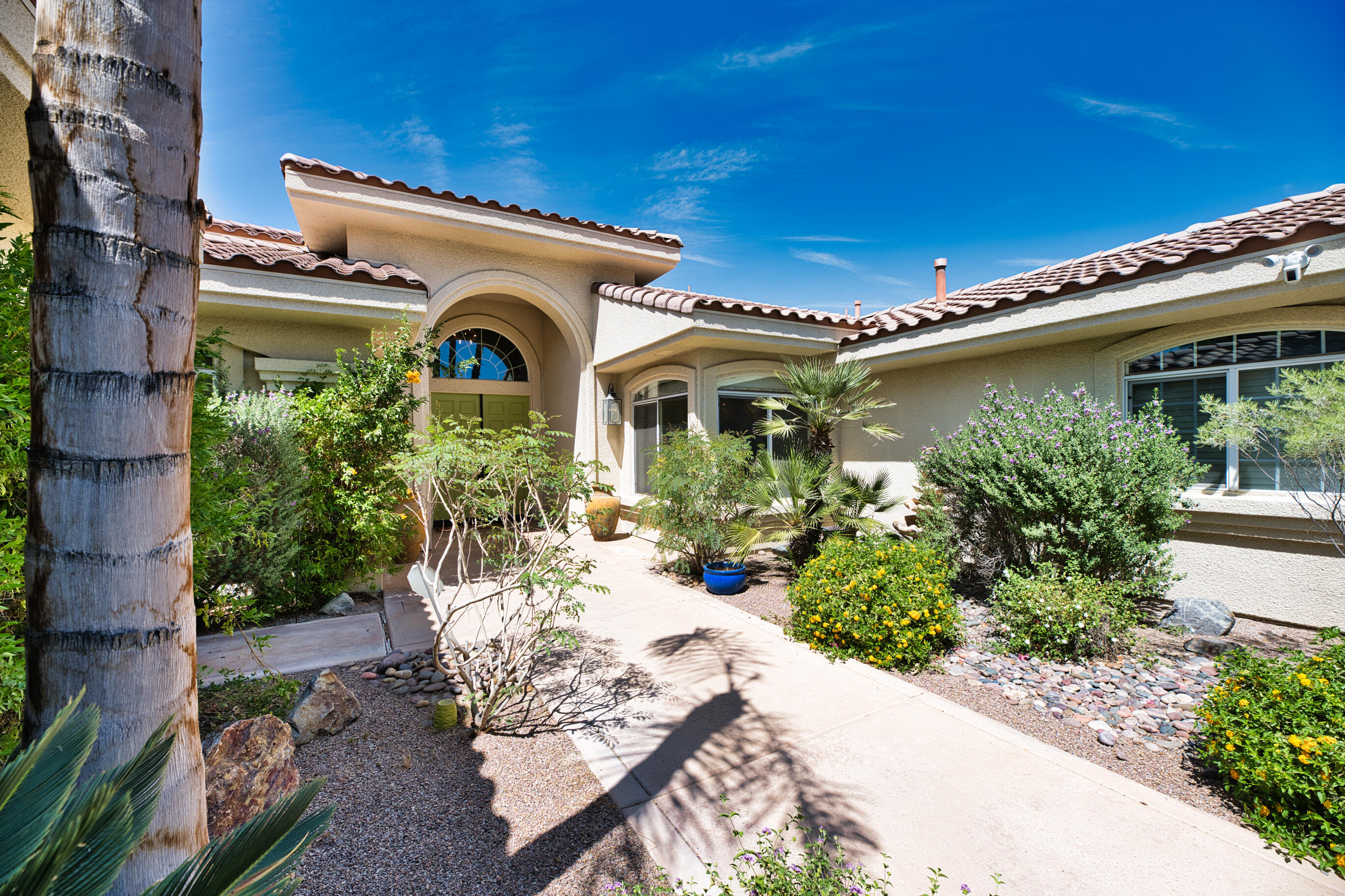 12 Varsity Circle Rancho Mirage, CA 92270 - Photo 64 of 70 a front view of a house with garden