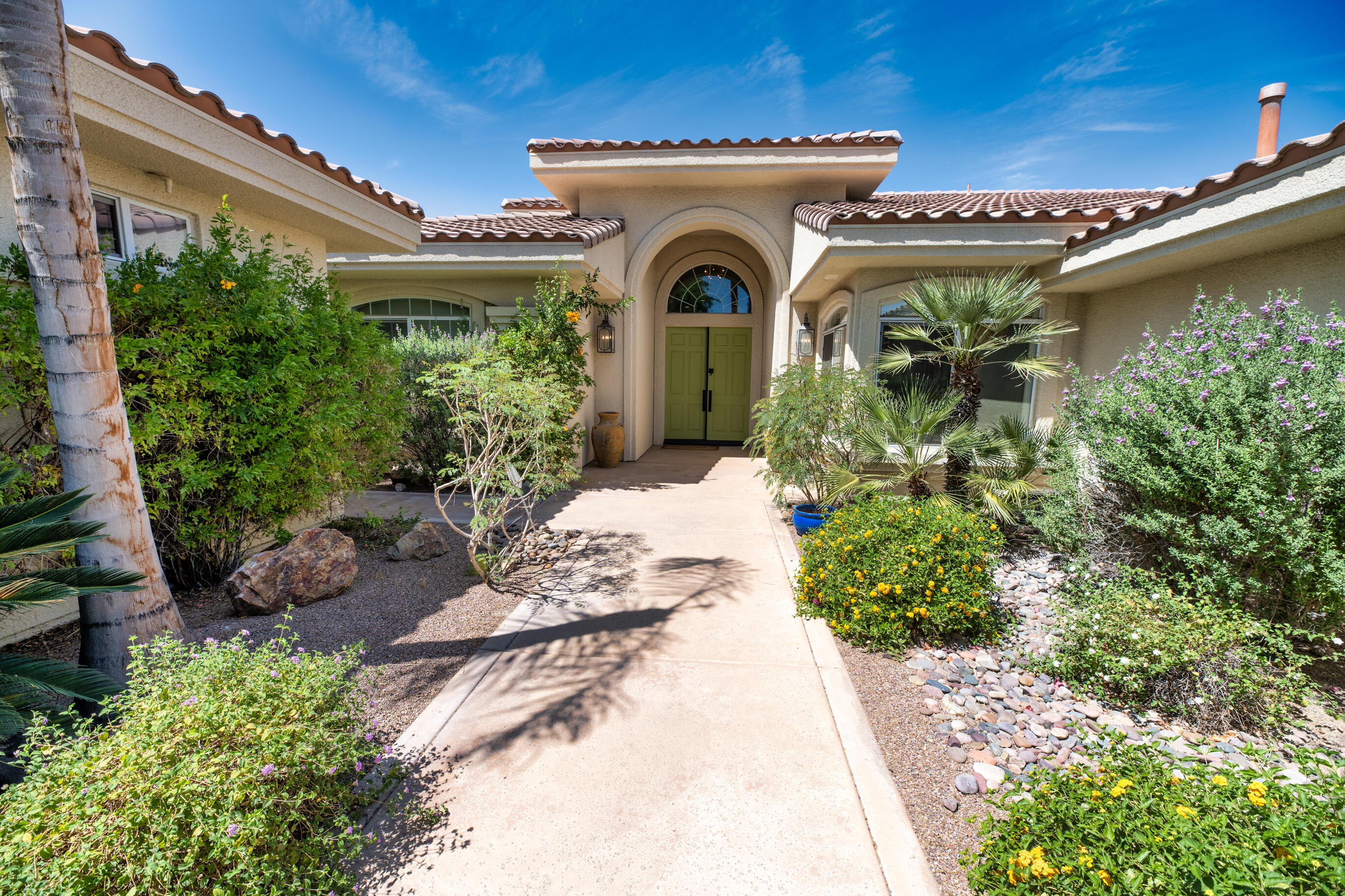 12 Varsity Circle Rancho Mirage, CA 92270 - Photo 67 of 70 a front view of a house with garden