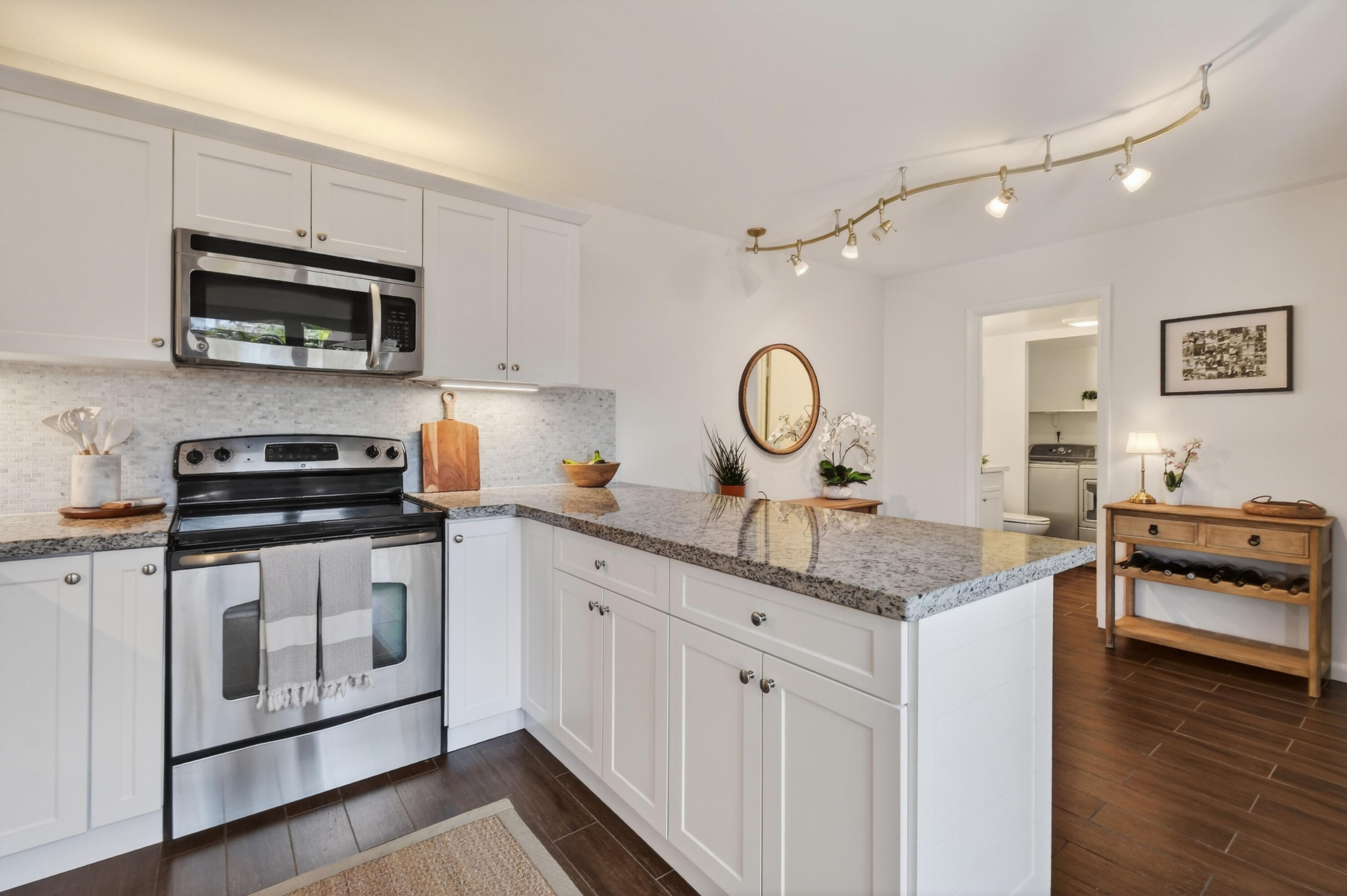 3900 County Line Road, Unit 15A Tequesta, FL 33469 - Photo 16 of 37 a kitchen with stainless steel appliances granite countertop a stove and a sink