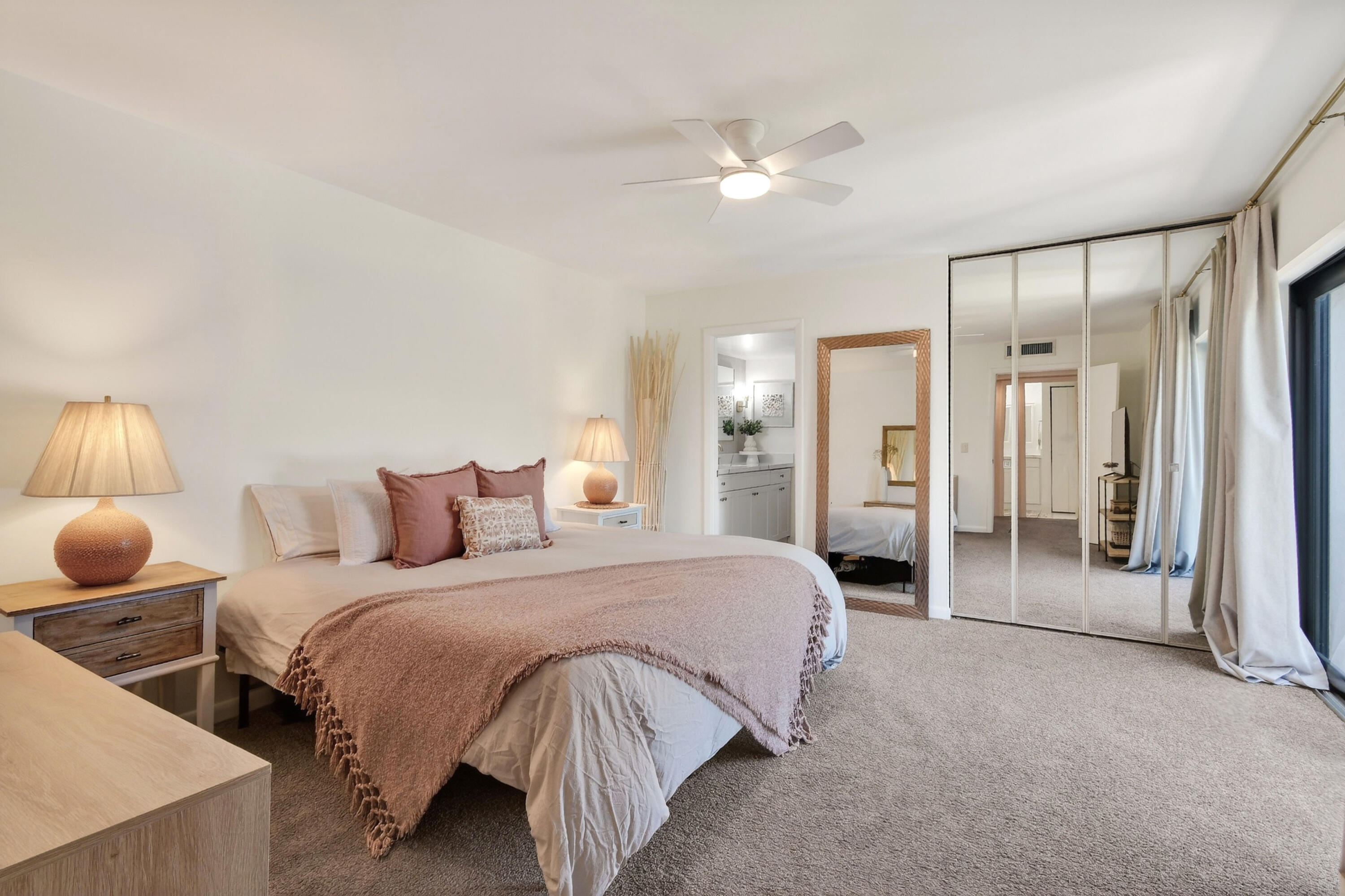 3900 County Line Road, Unit 15A Tequesta, FL 33469 - Photo 20 of 37 a spacious bedroom with a bed and lamp
