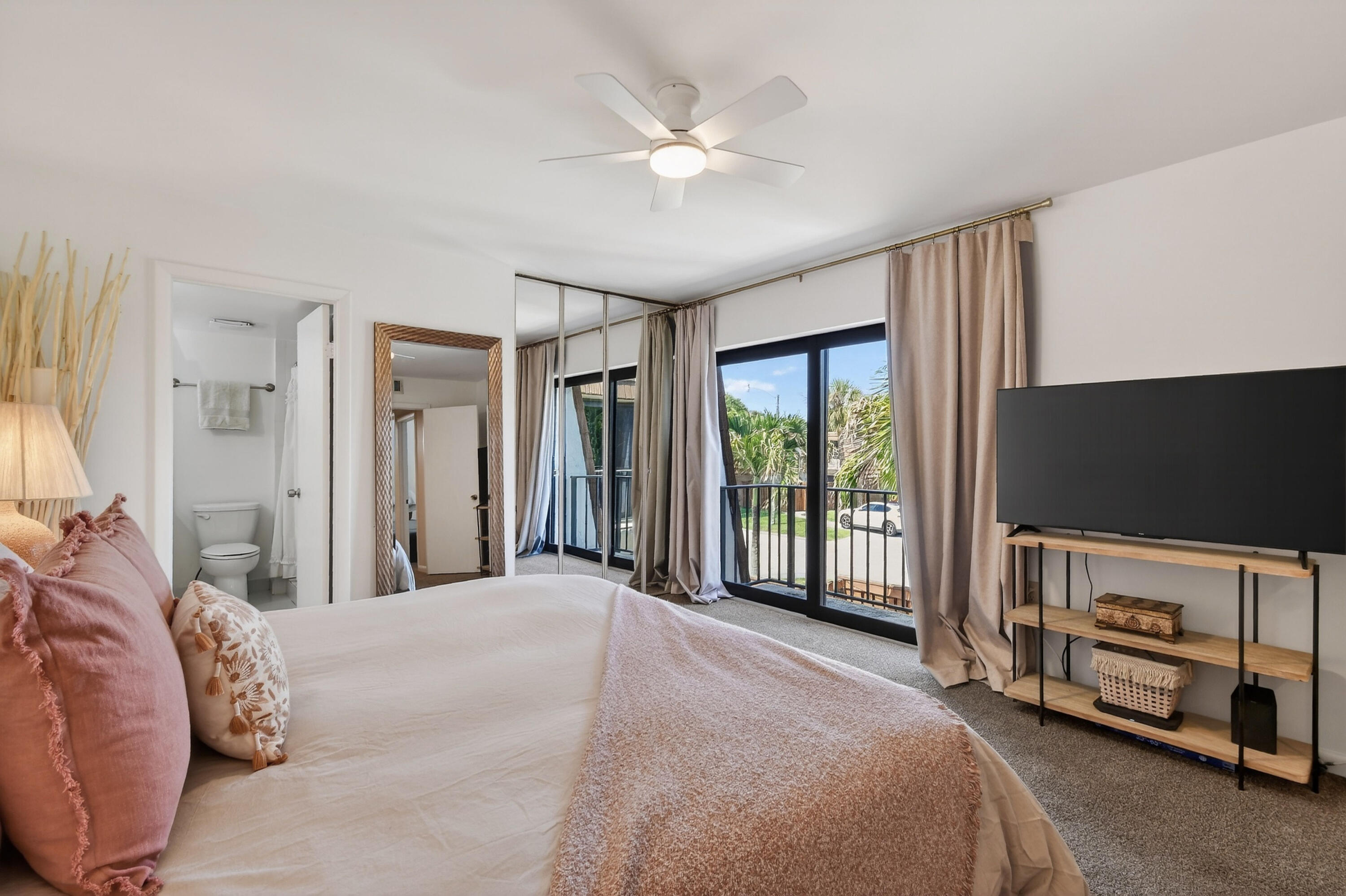 3900 County Line Road, Unit 15A Tequesta, FL 33469 - Photo 21 of 37 a bedroom with a bed and a flat screen tv