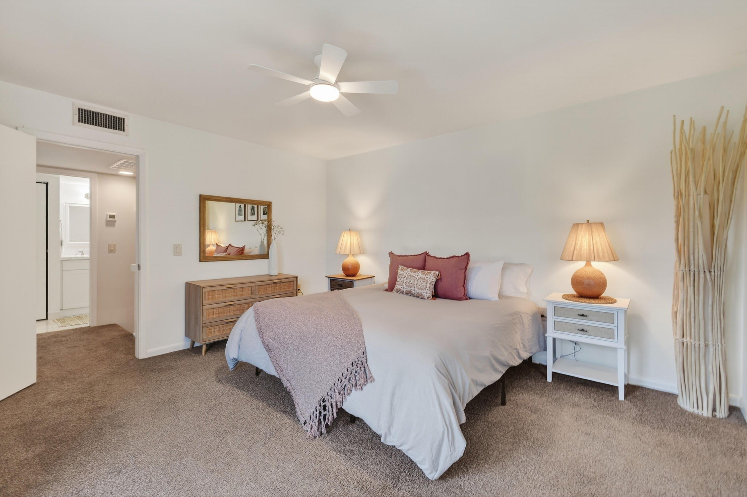 3900 County Line Road, Unit 15A Tequesta, FL 33469 - Photo 22 of 37 a bedroom with a bed and a chandelier