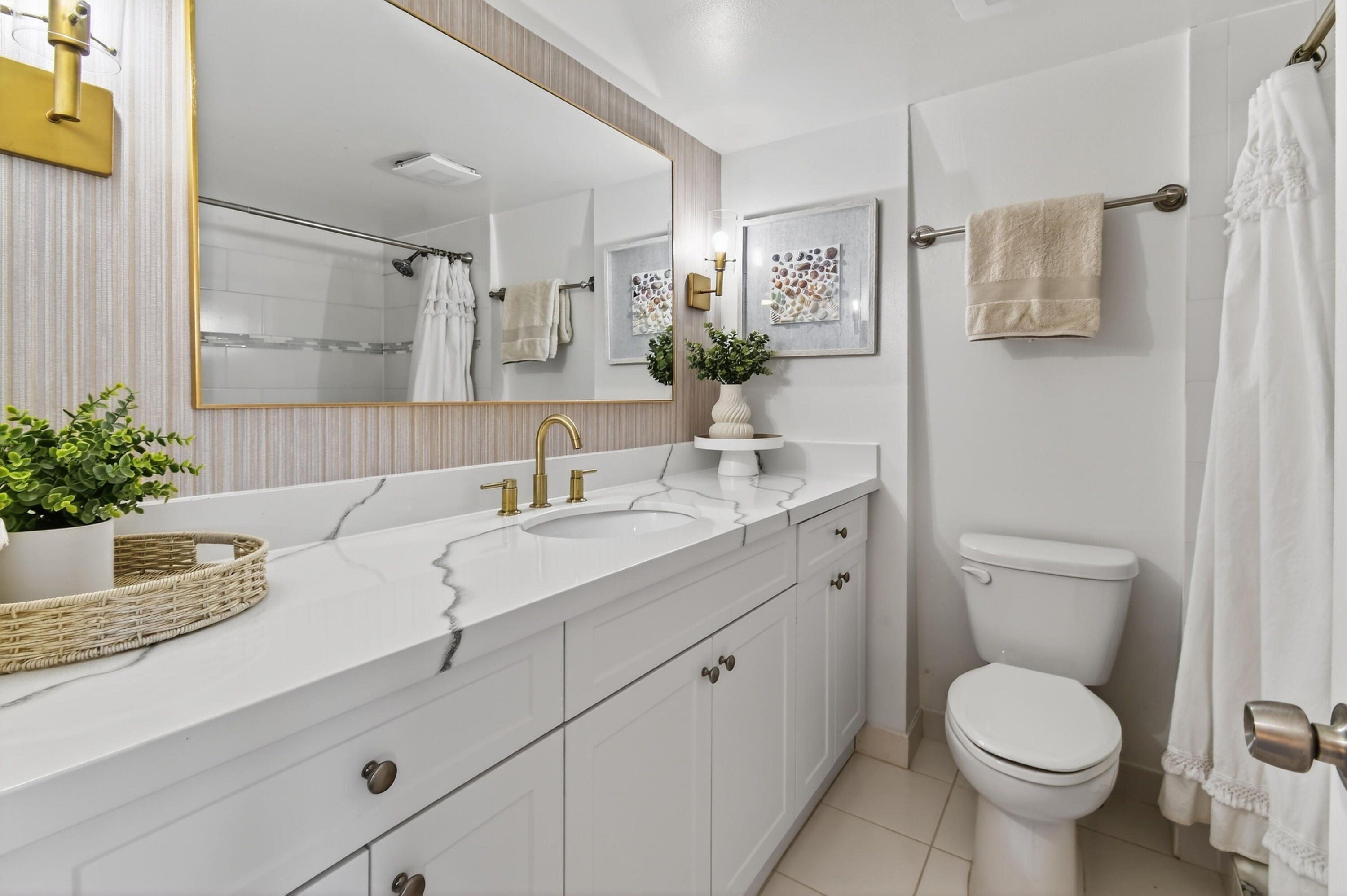 3900 County Line Road, Unit 15A Tequesta, FL 33469 - Photo 24 of 37 a bathroom with a toilet sink and shower