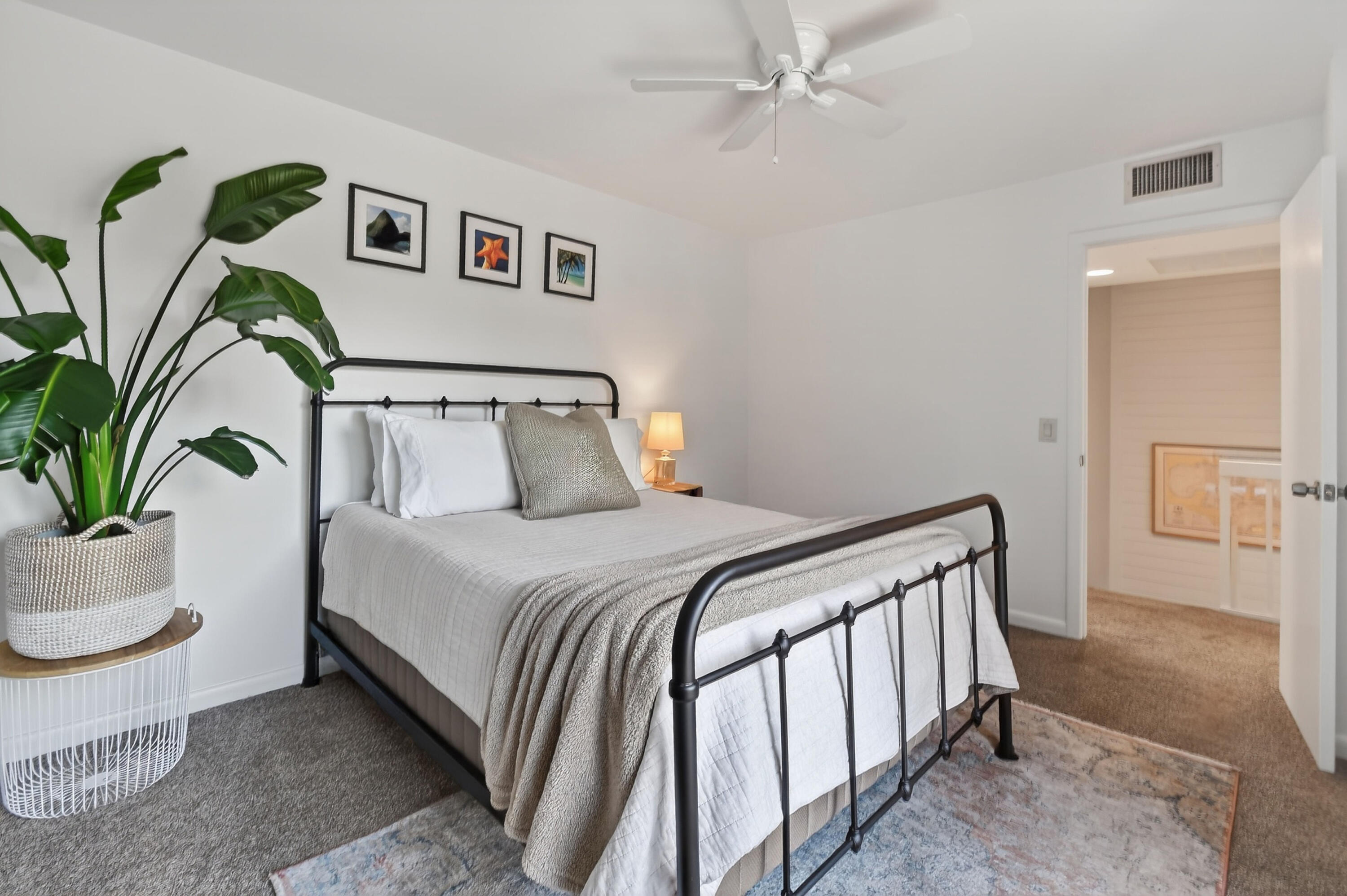 3900 County Line Road, Unit 15A Tequesta, FL 33469 - Photo 30 of 37 a bedroom with a bed and a potted plant