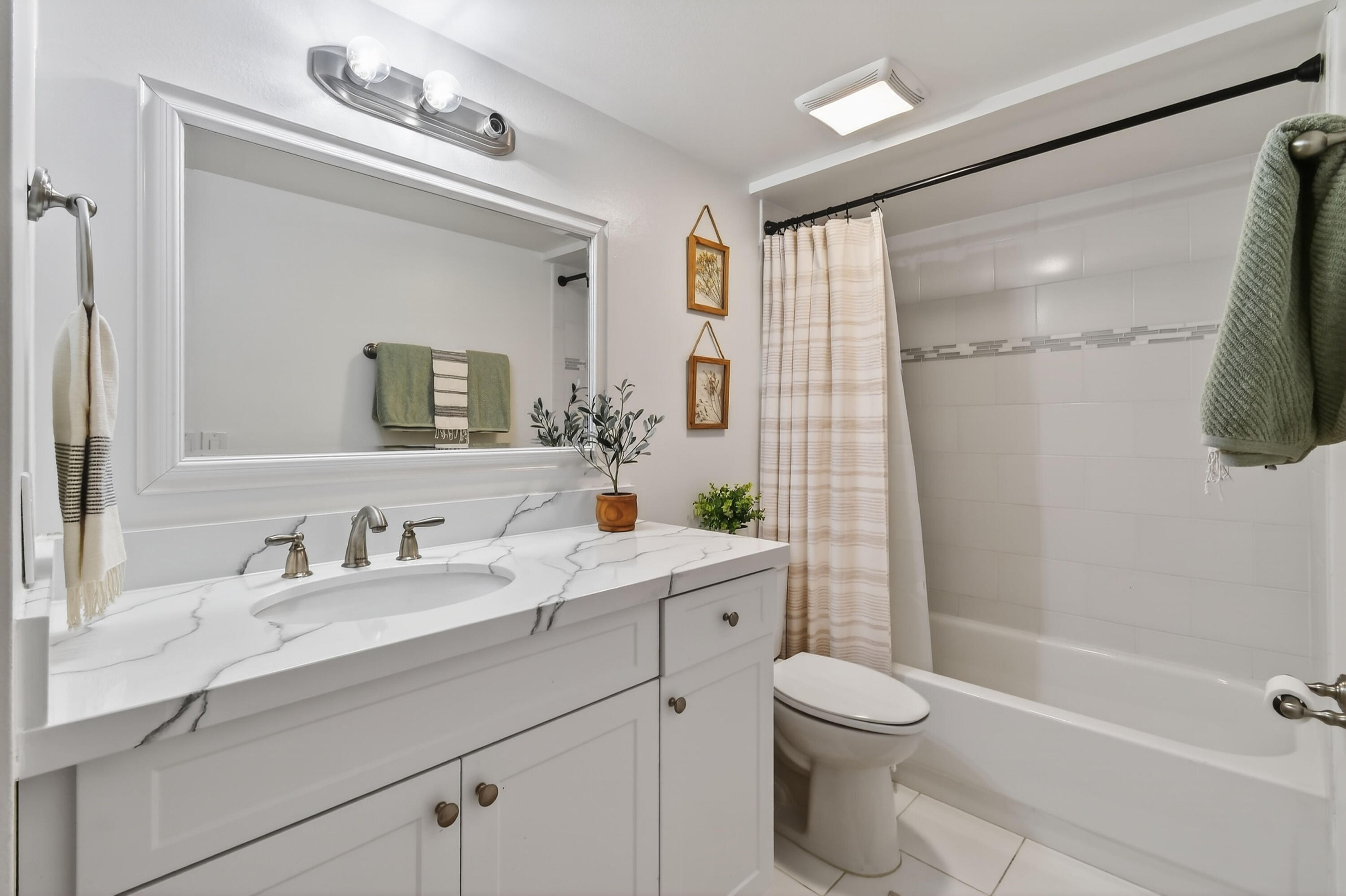 3900 County Line Road, Unit 15A Tequesta, FL 33469 - Photo 31 of 37 a bathroom with a sink a toilet and shower