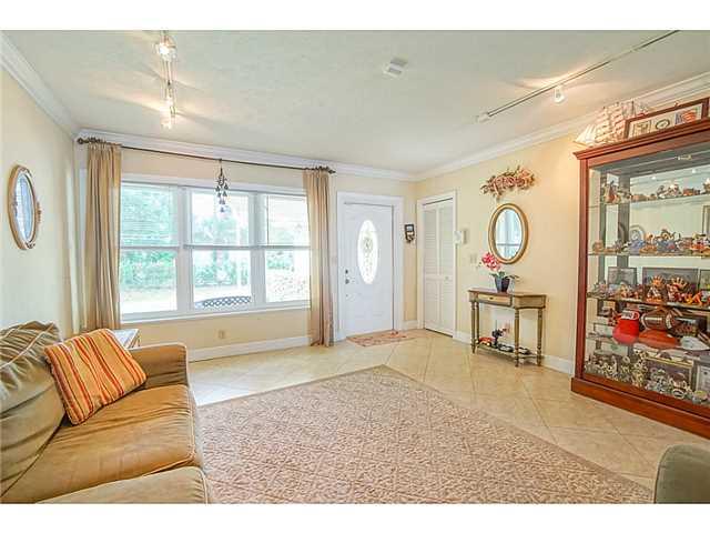 1041 Southeast Riverside Drive Stuart, FL 34996 - Photo 3 of 25 a living room with furniture and a window