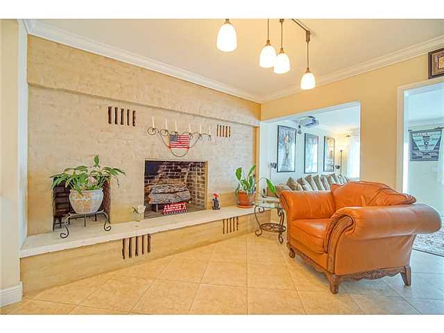 1041 Southeast Riverside Drive Stuart, FL 34996 - Photo 5 of 25 a living room with furniture and a chandelier