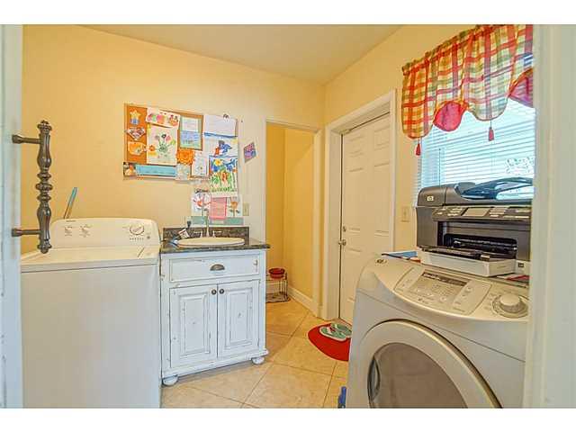 1041 Southeast Riverside Drive Stuart, FL 34996 - Photo 6 of 25 a utility room with closet dryer and washer