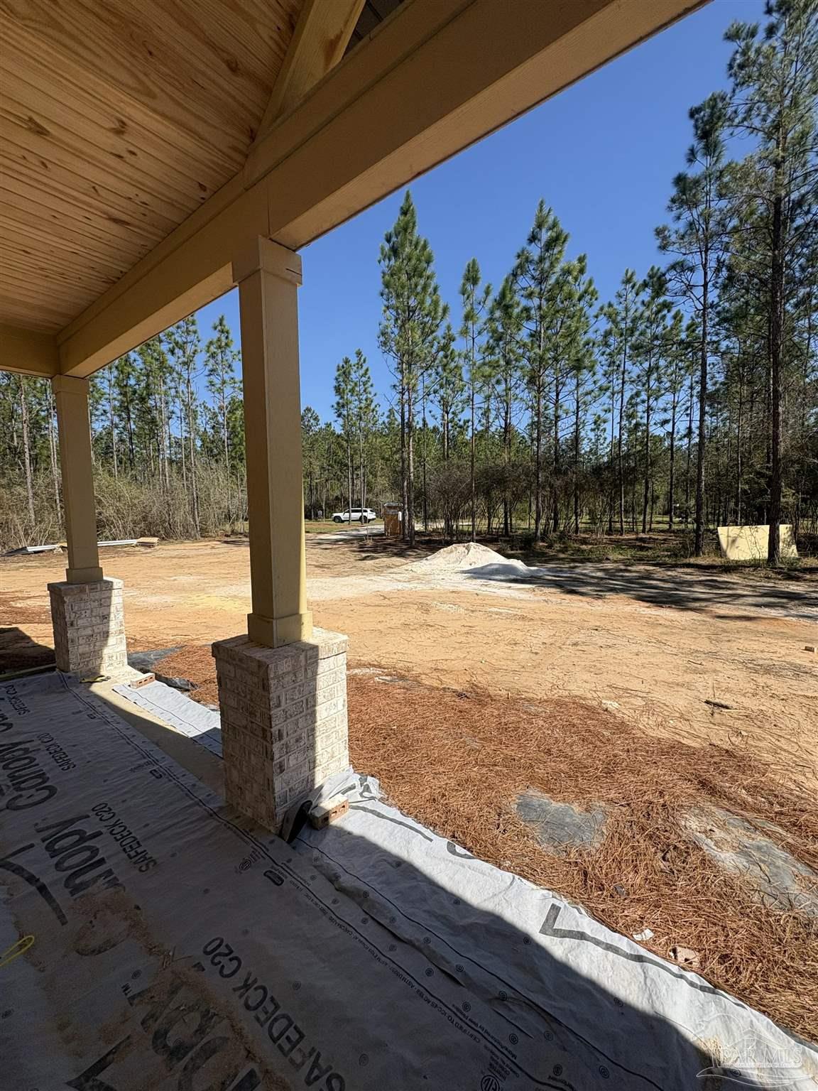 3571 Maple Branch Lane Milton, FL 32571 - Photo 4 of 6 a view of a yard with wooden fence