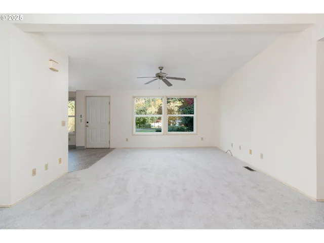 a kitchen with granite countertop a sink stainless steel appliances and cabinets