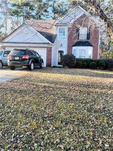a car parked in front of a house